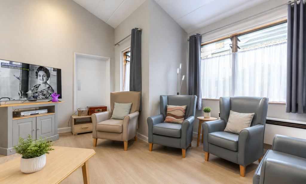 A large and spacious lounge, ideal for resting, watching TV, activities and a chat with other residents at Crossways