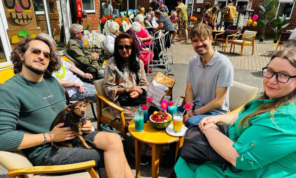 Residents enjoying mocktails from the tropical Tiki Bar at Broadgate’s Hawaii Summer Fete.