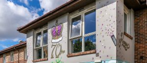 One of the Roseway House buildings painted with a crown on it along with the number '70' in the celebration of the Queen's 70th anniversary