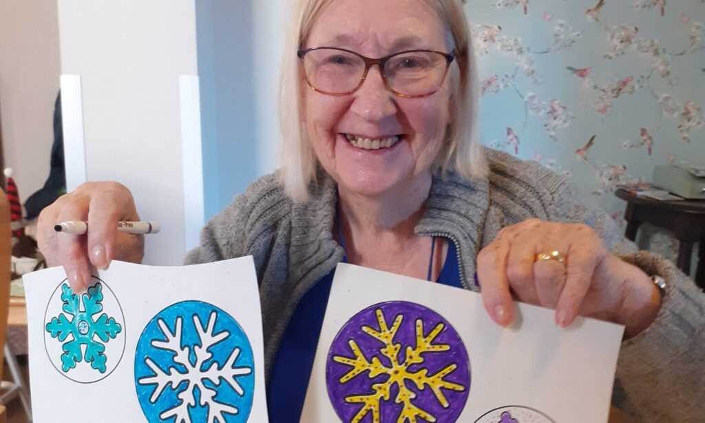 Astbury Lodge Resident showing their new year craft