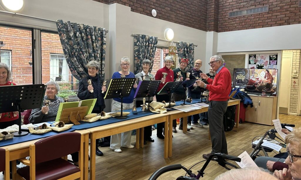 Crossways residents enjoying the bell ringers Choir