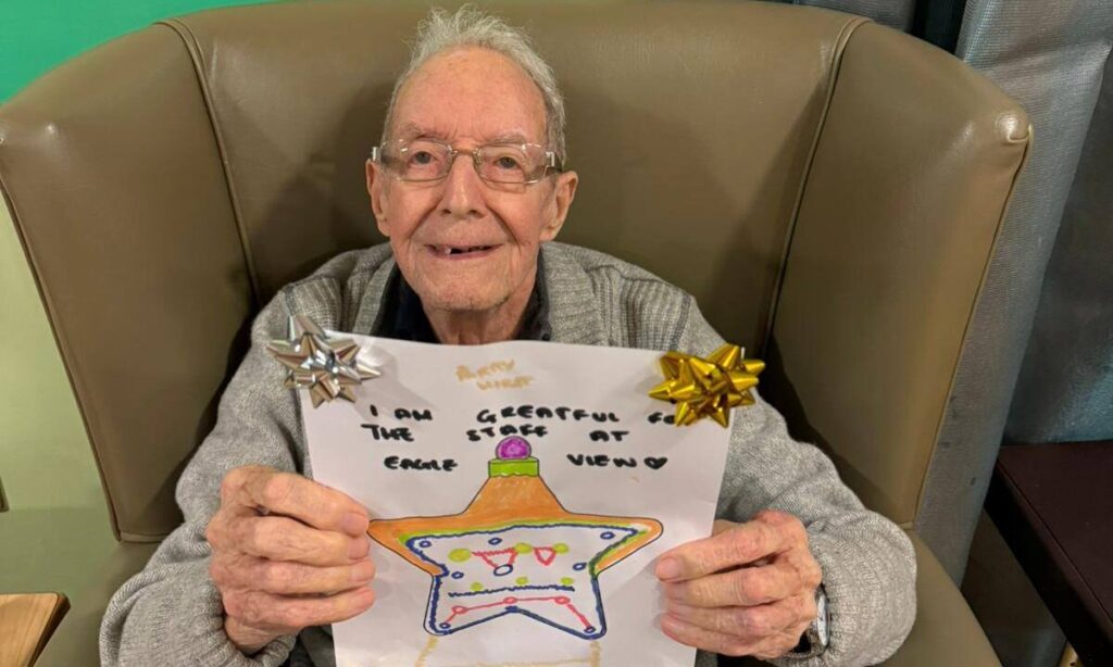 Residents creating gratitude baubles as part of a reflective Christmas activity at Eagle View.
