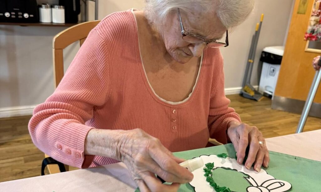 Residents at Eagle View making festive snowflakes and Christmas decorations