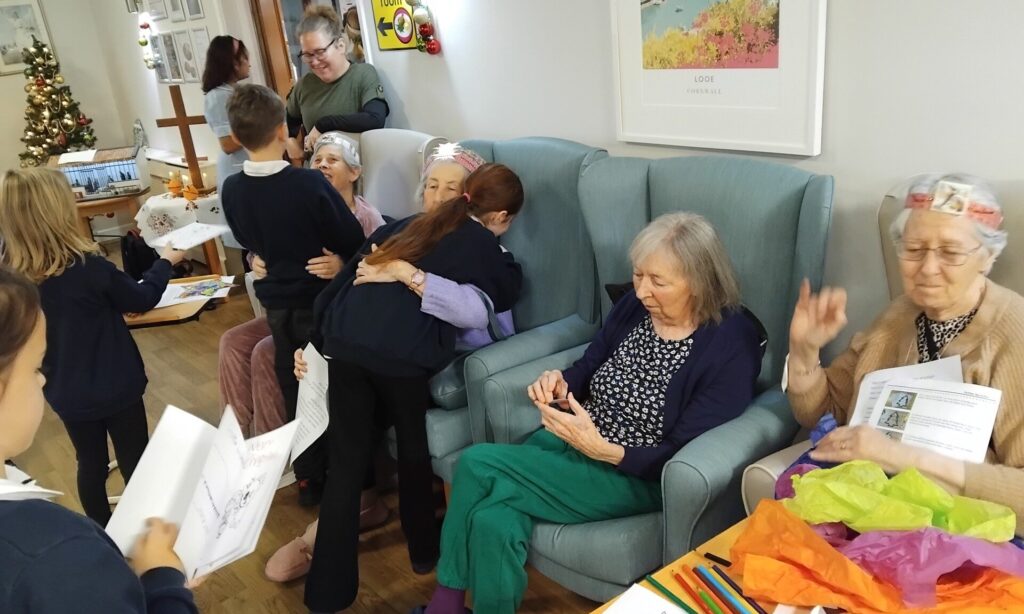 Intergenerational Christingle service at Hillcrest House with residents, church members, and school children