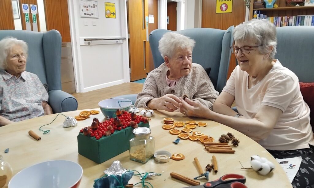 Residents enjoying a sensory Christmas reminiscence session at Hillcrest House