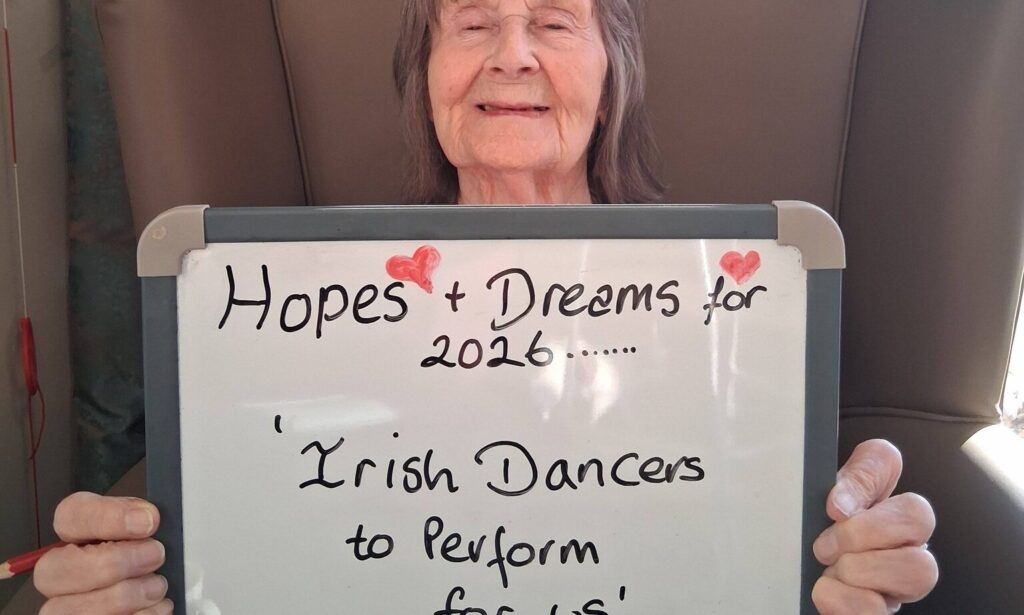 The Lakes resident holding her new year wish board