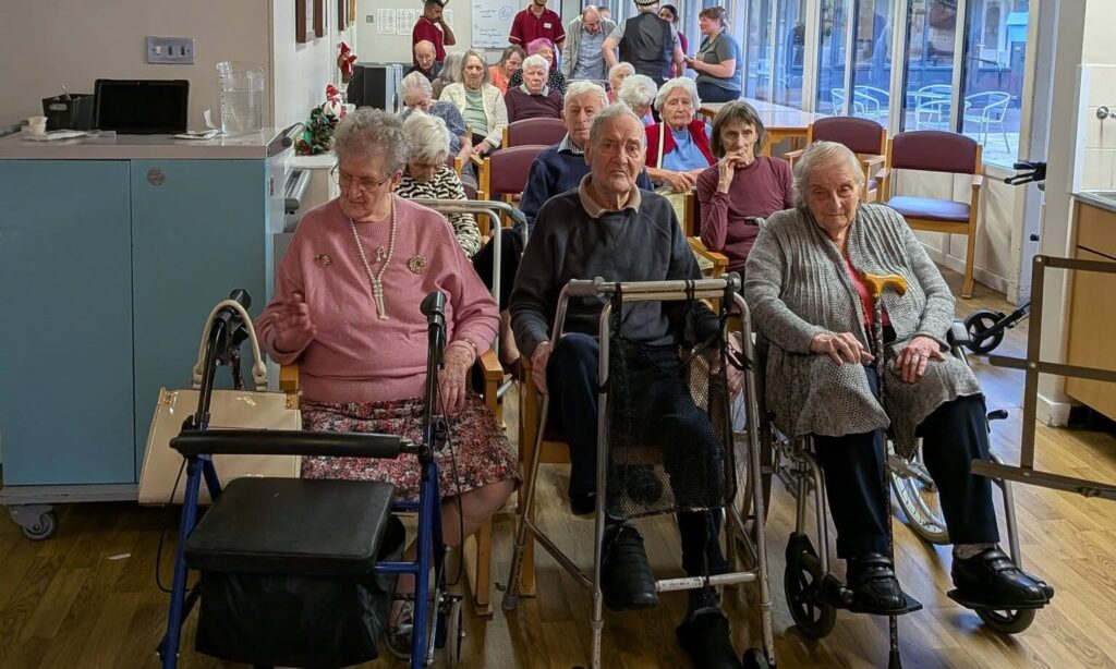 Turnpike Court residents enjoying the live performance for New year