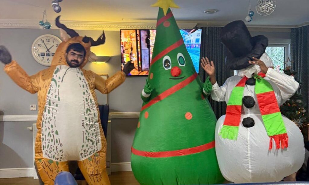 Waterside Care home staff members dressed up in inflatable costumes