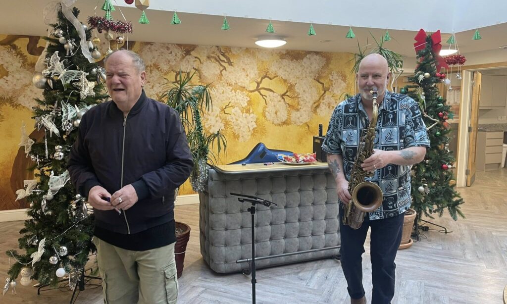 The Lodge live performers playing saxophone for new year