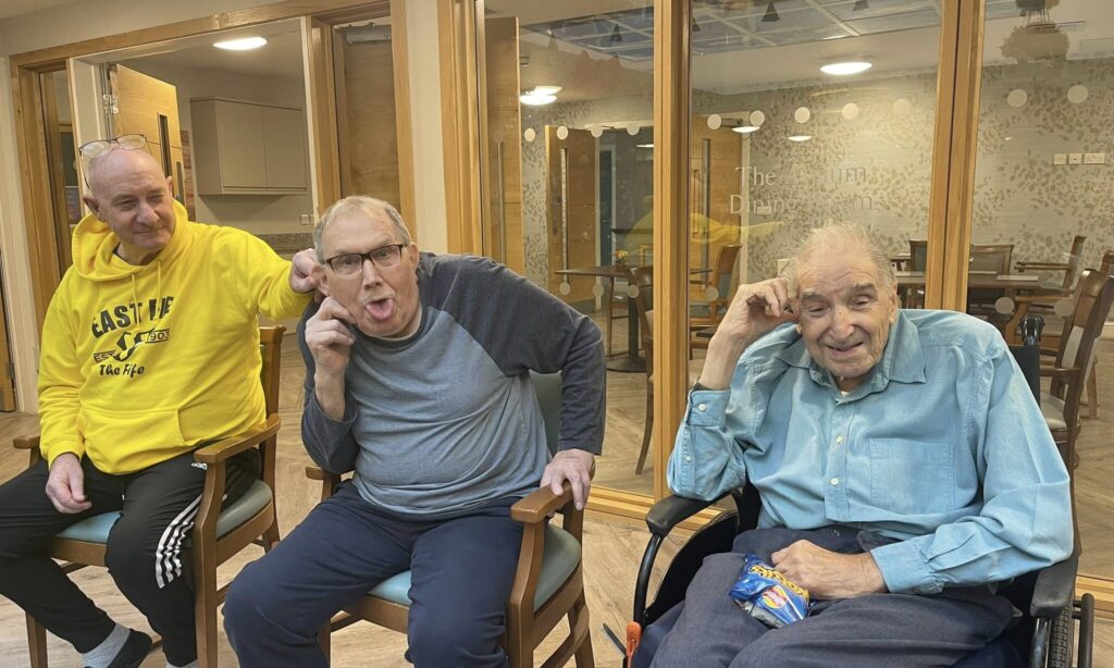 The Lodge residents enjoying the live saxophone performance for new year