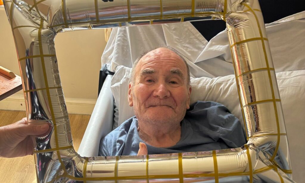 Resident and staff member celebrating Father's Day together at Red Hill Care Centre