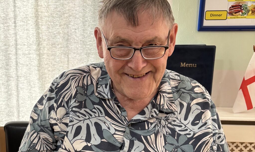 Residents enjoying fresh donuts and refreshments on Father's Day at Wealstone